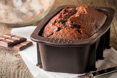 a loaf of chocolate cake sitting on top of a table