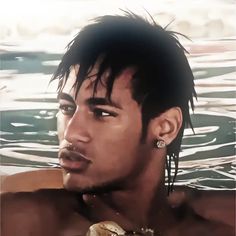 a close up of a person in the water with a snake around his neck and earrings