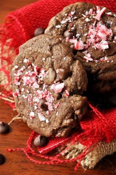 chocolate peppermint cookies with crushed candy canes on a red cloth and burlap