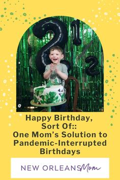 a young boy sitting in front of a birthday cake