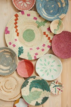 several woven baskets are arranged on the floor