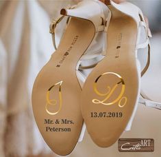 the bride's shoes were decorated with gold monogrammed letters and their names