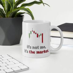 a coffee mug that says it's not me, it's the market