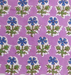 blue flowers and green leaves on a purple background