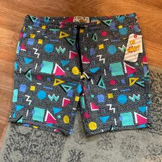 Oh Snap! By Drill Clothing Co. Xl Shorts New With Tags Retail $52.00 Cotton Spandex Blend Measurements Taken Laid Flat Are Approximate: Waist 19 Inches, Rise 12 Inches, Inseam 7 Inches 9 Oz Nocon Summer Athleisure Bottoms With Graphic Print, Casual Fitted Swim Trunks With Built-in Shorts, Casual Stretch Swim Trunks For Loungewear, Casual Stretch Swim Trunks, Fun Black Bottoms For Spring, Retro Black Summer Bottoms, Casual Multicolor Swim Trunks With Elastic Waistband, Fitted Graphic Print Bottoms For The Beach, Fitted Graphic Print Beach Bottoms