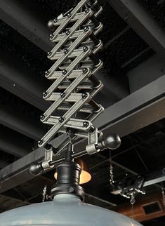 an overhead view of a metal light fixture with multiple lights on it's sides