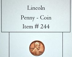 the lincoln penny - coin item is displayed in front of a white sheet with black writing