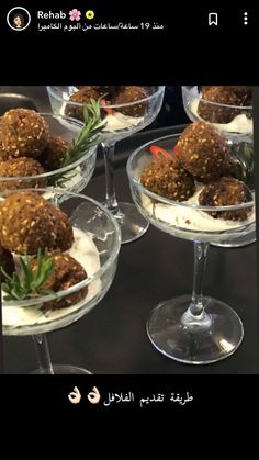 some desserts are in small glasses on a table with the caption reads, what is it?