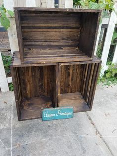 an old wooden box sitting on the sidewalk