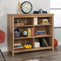 a book shelf with books and toys on it