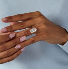 a woman's hand with a ring on it