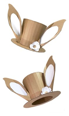 two paper hats with white flowers on the top and one is made out of cardboard