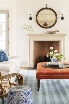 a living room filled with furniture and a fire place