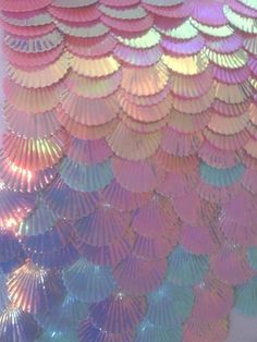 an array of colorful umbrellas hanging from the ceiling