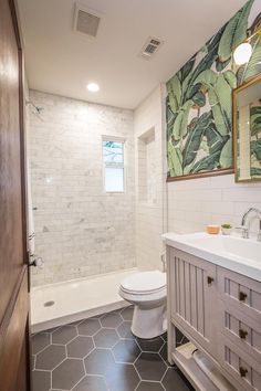 a bathroom with a white toilet sitting next to a bath tub