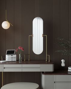 a desk with a mirror, stool and flowers on it in front of a brown wall