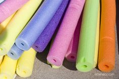 several different colored plastic tubes lined up in a row