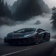 a black sports car driving down a foggy road