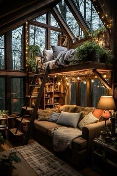 a loft bed with a ladder to the top and lots of pillows on it in front of windows