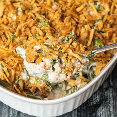 a casserole dish filled with green beans and cheese