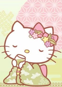 the hello kitty is wearing a green kimono and holding a flower in her hand