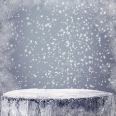 an empty wooden table with snow falling down on it royalty images and stocking materials