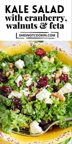 kale salad with cranberry, walnuts and feta in a yellow bowl