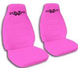 pink car seat covers with black flowers on the front and rear seats, set of two