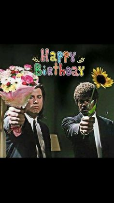 two men in suits are holding flowers and pointing at the camera with happy birthday written on it