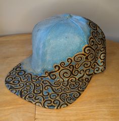 This one of a kind, snap-back baseball cap is hand painted to show off your unique sense of style. One size fits most; scotchguarded to protect the detailed painting. All sales are final due to the nature of the product. Artistic Snapback Hat One Size Fits Most, Handmade Snapback Hat, Artistic Adjustable Snapback Baseball Cap, Artistic Adjustable Baseball Cap, Artistic Snapback Hat, One Size Fits Most, Artistic Hand Painted Adjustable Hats, Artistic Hand Painted Cap, Adjustable Blue Hand Painted Hat, Adjustable Hand Painted Brimmed Hat