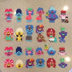 an assortment of pixel characters are displayed on a counter