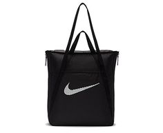 Nike Gym Men's/Women's Tote Your fitness journey calls for a multidimensional Bag like the Nike Gym Tote. Expanding fabric panels create extra space when necessary. Meanwhile, multiple deep pockets on the inside organize toiletries. Throw your phone, an umbrella or keys in the snap pocket on the back or the hook & loop front pocket. Made with at least 20% recycled content by weight. Move to Zero: a journey toward zero carbon & zero waste.  Short carry handles  Long shouler handles Nike Tote Bags, Nike Retail, Sac Tote Bag, Gym Club, Sport Nike, Gym Tote, Nike Bags, High Leg Boots, Black Tote