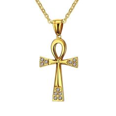 This lovely ankh endant symbol is set in a simple golden design with cubic zircona pieces set at the ends of the pendant. Truly stunning, the ankh is an ancient Egyptian symbol often used to symbolize life. Literally translated as "breath of life", this hieroglyphic is often used in funerary art. The piece itself is made from 316L stainless steel and lpated in a lovely 18K Gold finish. The matching chain extends up to 24" and comes with the 64 mm x 37 mm Innovato Design piece. This accessoy makes a beautiful piece that you can cherish for yourself or ift to a friend.  Product Highlights    Made from 316L stainless steel  Gold-plated finish  Lovely Ankh Pendant Design  Long gold chain necklace The Ankh, Breath Of Life, Ancient Egyptian Symbols, Ankh Cross, Golden Design, Egyptian Symbols, Pendant Design, Gold Chain Necklace, Ancient Egyptian