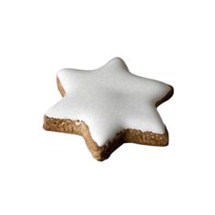 a white star shaped cookie sitting on top of a table