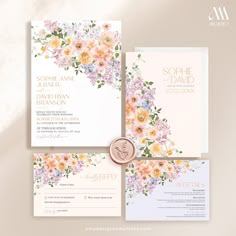 wedding stationery with flowers on it and a wax seal in the middle is shown