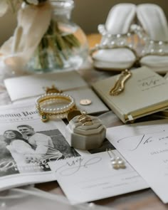 a table topped with lots of cards and jewelry