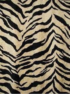 an animal print rug with black and white stripes