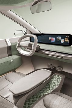 the interior of a car with an electronic device in the center and on the dashboard