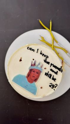 a birthday cake with the words can i keep peace? and she's still wearing a crown on it