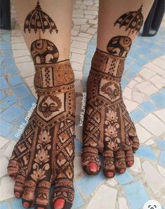 the feet are decorated with henna designs