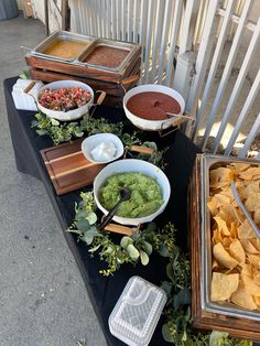 a table topped with lots of different types of food and condiments on top of it