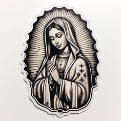 a black and white sticker depicting the virgin mary