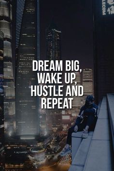 a man sitting on top of a ledge in front of a cityscape with the words dream big wake up, hustle