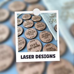 a bunch of wooden buttons that say laser designs