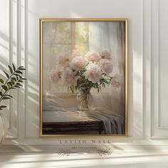 a vase filled with pink flowers sitting on top of a table next to a window