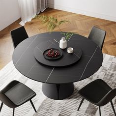 a black table with four chairs around it