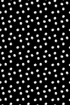 a black and white polka dot pattern with small dots on the bottom half of it