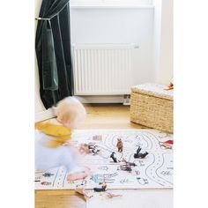 a baby playing with toys on the floor