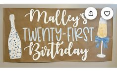 a sign that says mallys's twenty - first birthday with a bottle of champagne next to it