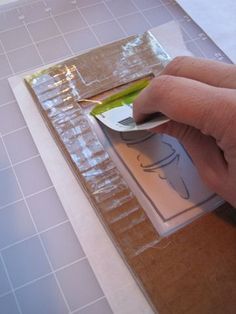 a person is using a spoon to mix up ingredients in a container on the counter